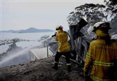 Australian Bushfires Raze Homes in Two States; Firefighter Dies