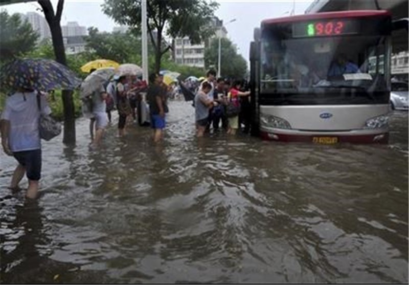 Dozens Dead as Floods, Typhoon Ravage China