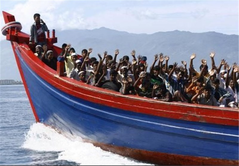 Myanmar Escorting Boat Crammed with Migrants to &apos;Safe&apos; Area
