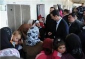 Assad Visits Displaced Syrians outside Damascus: TV