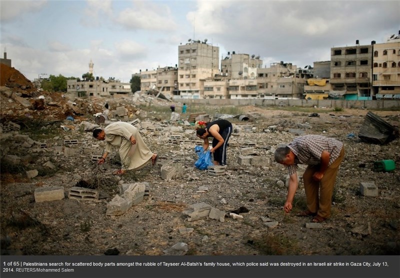 عکس؛ جستجو برای یافتن تکه‌های بدن یک خانواده در غزه!