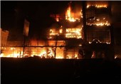 آتش سوزی مجتمع تجاری پوشاک در شهر «مزار شریف» + تصاویر