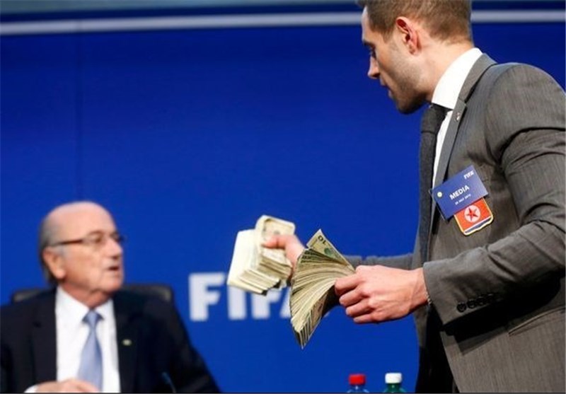 Prankster Showers Blatter with Fake Dollar Bills at Fifa Press Conference