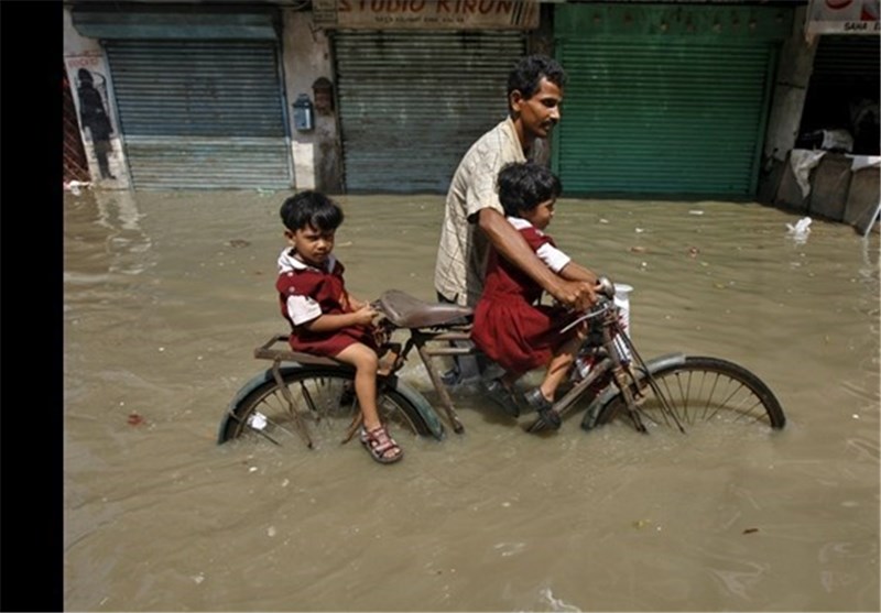 Monsoon Floods Kill 14 in India&apos;s Remote Northeast