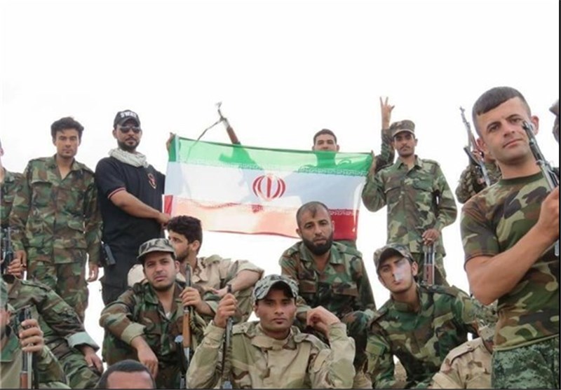 عکس/ اهتزار پرچم ایران توسط عراقی‌ها
