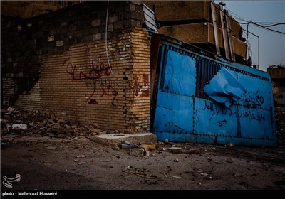 دیوار نوشته با عنوان منطقه بمب گذاری شده است در شهر فلوجه