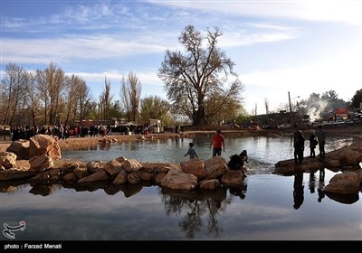 Visitors Tour Taq-Bostan Historical Site in Western Iran
