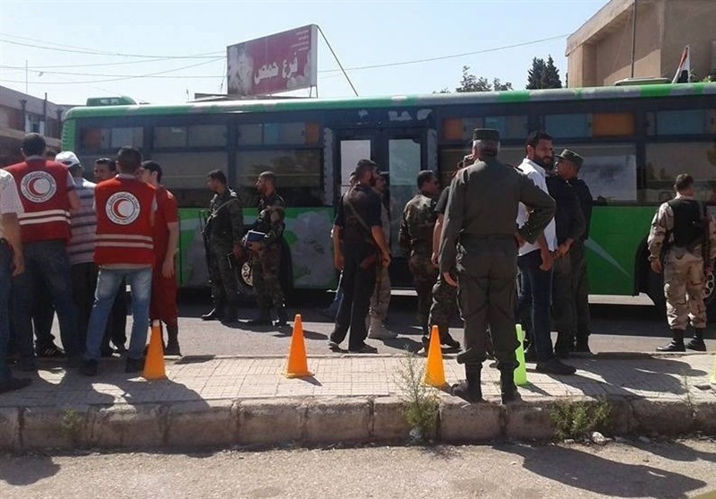 إنجاز المرحلة الأخیرة لإجلاء المسلحین من حی الوعر فی مدینة حمص +صور