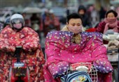 عکس / پوشش عجیب موتورسواران چینی برای مقابله با سرما
