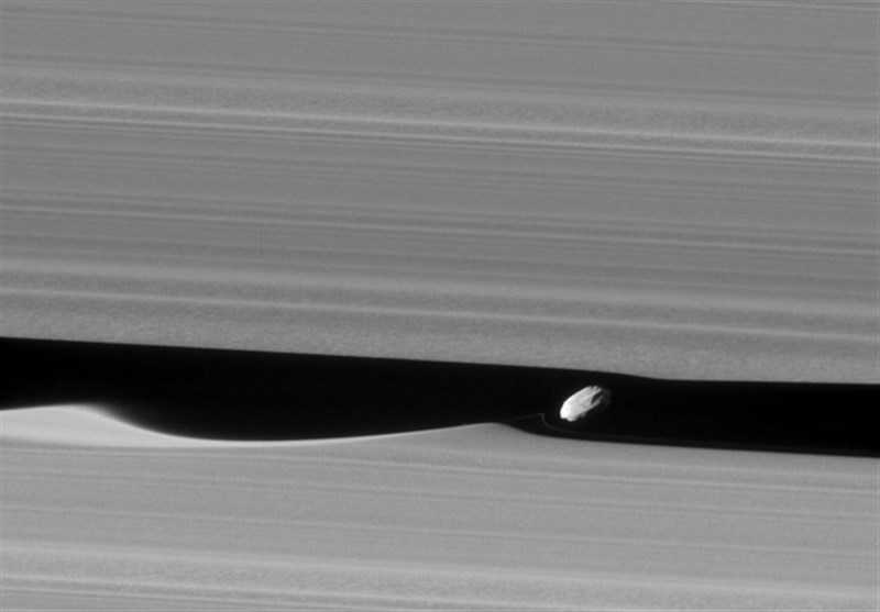 Saturn&apos;s Moon Creates Spectacular Ripples in Planet&apos;s Rings