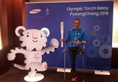 میرزاحسینی، مشعل المپیک زمستانی را حمل می‌کند