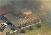 Bushfires Destroy Buildings in Australia as Heat Wave Melts Highway Surface