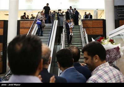Iranian Referee Warmly Received by Fans at Tehran Airport