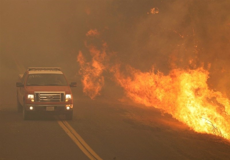 Flames Inch Close to California Homes as Thousands Evacuate