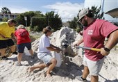 People fill sand bags in Isle of Palms, South Carolina on Monday as the state&apos;s entire coastline was ordered to prepare for mandatory evacuations