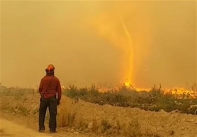 Incredible Fire Whirl Swallows Wildfire Crew&apos;s Hose in Northern British Columbia