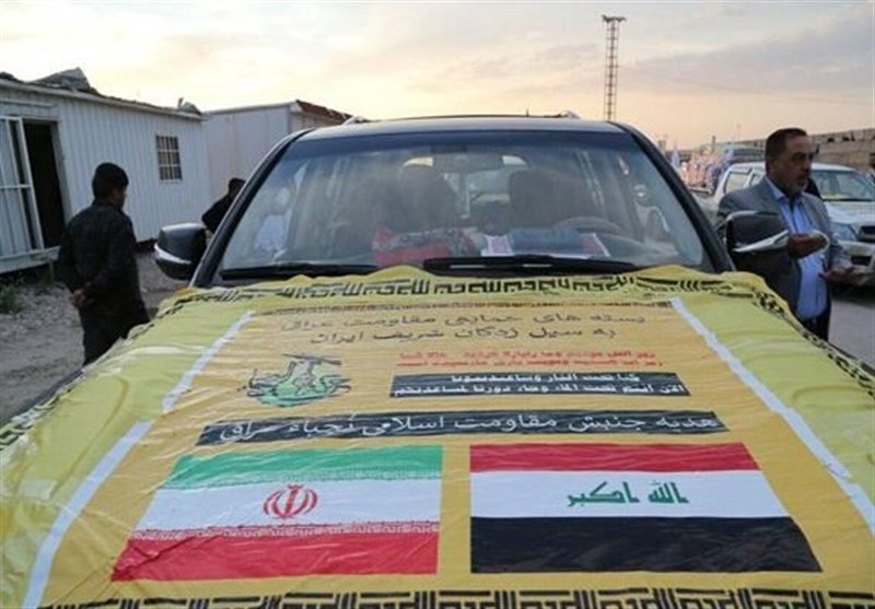 Aid Convoy of Iraq’s Nujaba Arrives in Iran’s Flood Hit Areas (+Photos)
