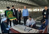 ادای احترام خدام امام رضا(ع) به شهدای کرمانشاه+ تصاویر