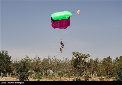 Iranian Military Commandoes Parachute from Milad Tower