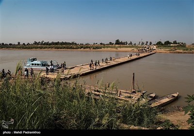 پل ارتباطی دهستان عنافچه به شهر ملاثانی فروردین ماه امسال به دلیل جاری شدن سیل دچار آسیب و قطعات این پل شناور از یکدیگر جدا شد و چندین بار این پل مورد ترمیم قرار گرفت اما در نهایت با غرق شدن قطعاتی از این پل راه ارتباطی مردم دهستان عنافچه به شهر ملاثانی این شهرستان قطع شد و مردم این منطقه 7ماه است که برای تردد از قایق استفاده می کنند رودخانه کارون از کنار دهستان عنافچه عبور می کند و این دهستان را از مرکز شهرستان باوی (شهر ملاثانی) جدا می کند