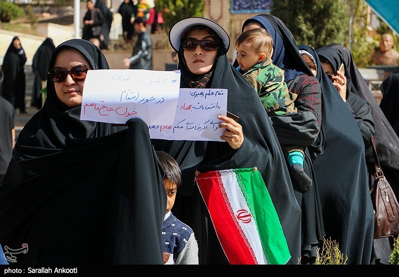 Women posed with signs before voting