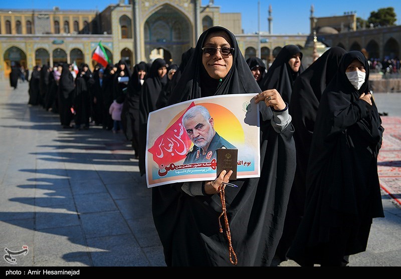 A woman held up a poster of slain the Qods Force commander Qassem Soleimani