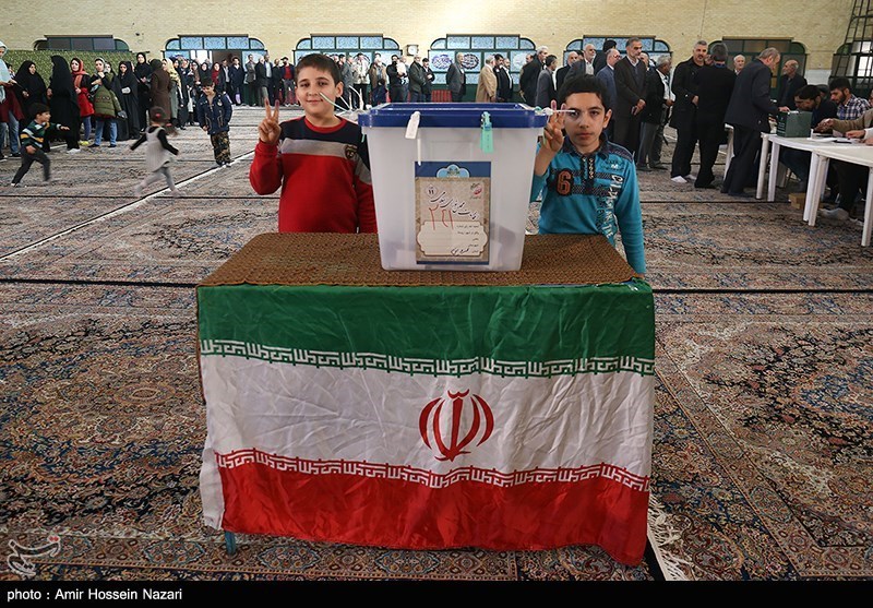 Children posed next to a ballot box in Qazvin