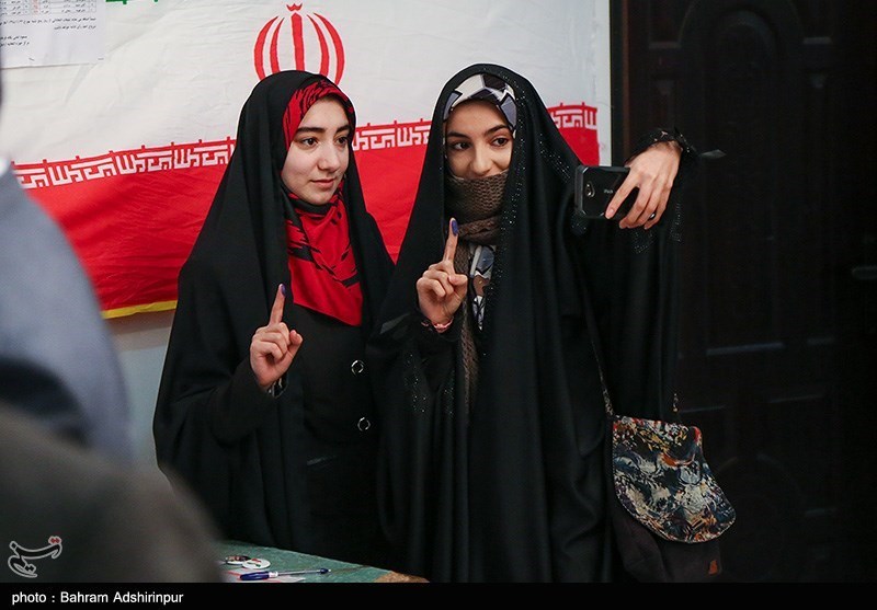 Young women posed for a picture while voting in Ardabil