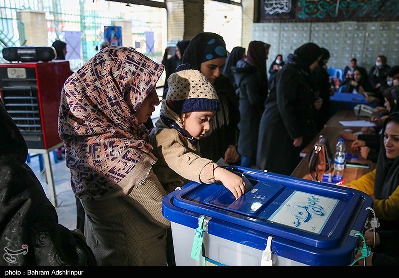 A child submits his mother’s vote in Ardebil