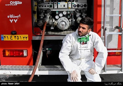 Iranian Firemen Sanitize Neighborhood in Western Tehran
