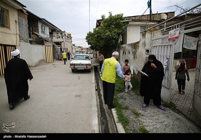 پاكسازی و ضدعفونی محلات و توزيع ماسك رايگان درب منازل در محلات حاشیه نشین شهرستان گرگان توسط خادمین موکب علی بن موسی الرضا(ع) استان گلستان