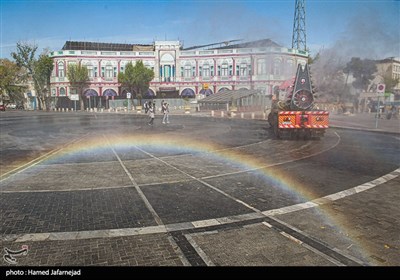 ضد عفونی میدان حسن آباد تهران برای جلوگیری از ویروس کرونا توسط خودروهای مه پاش آتشنشانی