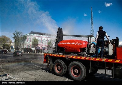 ضد عفونی میدان حسن آباد تهران برای جلوگیری از ویروس کرونا توسط خودروهای مه پاش آتشنشانی