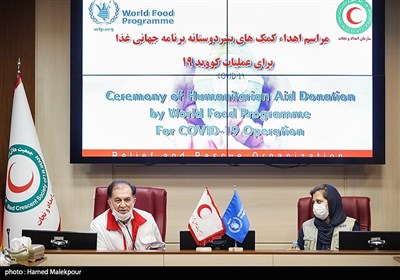 نگار گرامی نماینده برنامه جهانی غذا در ایران و مرتضی سلیمی رئیس سازمان امداد و نجات جمعیت هلال احمر