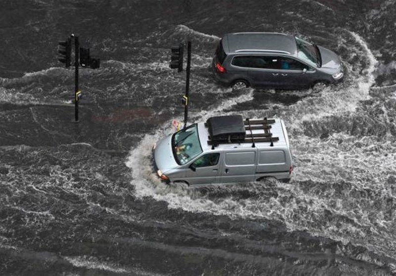 London Roads Flood As Storms Roll In