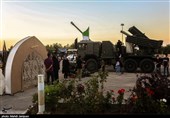 نمایشگاه هفته دفاع مقدس در کنار مزار شهدای گمنام شهرستان بهارستان اصفهان به روایت تصویر