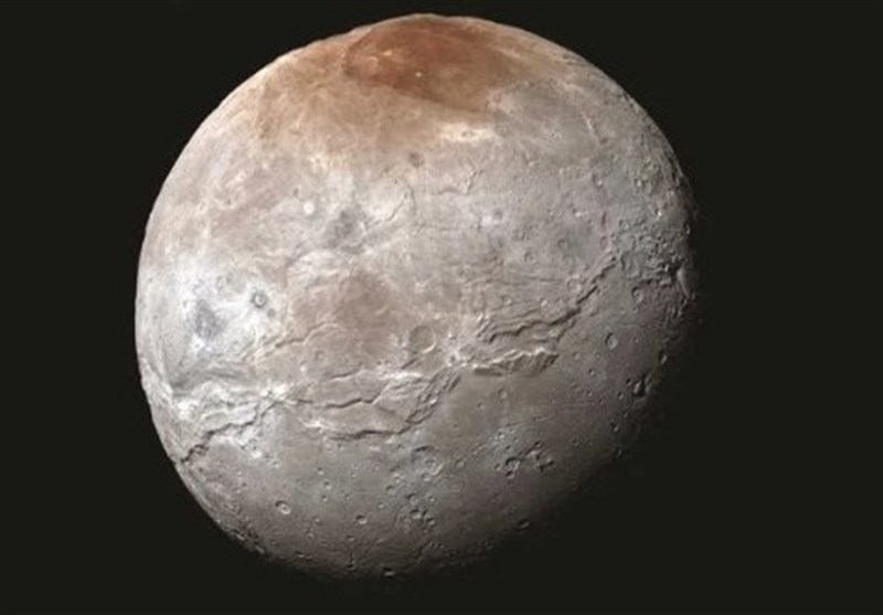 Pluto&apos;s Moon Has A Mysterious Red North Pole, And We May Finally Know Why