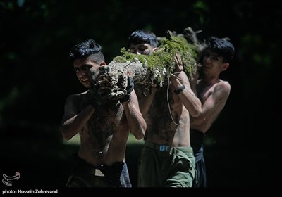 کارگاه تاب و توان جسمانی با حمل کنده های درخت 