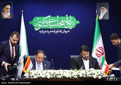 امضای تفاهم نامه بین رافل یاسین خٌضیر با مهرداد بذرپاش رؤسای دیوان محاسبات ایران و عراق