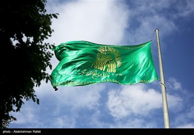 آیین اهتزاز پرچم رضوی بر فراز شهر همدان