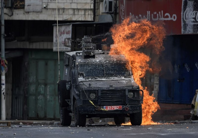Palestinian Fighters Set Israeli Army Vehicles on Fire in Tulkarem
