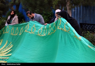 مراسم اهتزاز پرچم رضوی بر فراز همدان