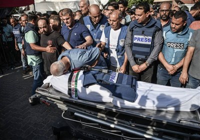 خبرنگار،فلسطيني،غزه،نوار،بمباران،شهادت،همراه،باريكه