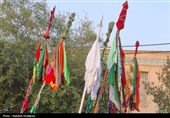 آیین "سلام دادن علم" به یاد علمدار کربلا