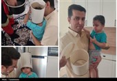 آتشنشانان قمی کودک گرفتار در سطل را نجات دادند+ عکس