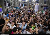 Heroes Return: Iranian Wrestling Champions Greeted by Throngs at Tehran Airport