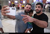 Heroes Return: Iranian Wrestling Champions Greeted by Throngs at Tehran Airport