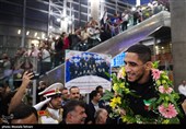 Heroes Return: Iranian Wrestling Champions Greeted by Throngs at Tehran Airport