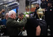 Heroes Return: Iranian Wrestling Champions Greeted by Throngs at Tehran Airport