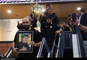 Heroes Return: Iranian Wrestling Champions Greeted by Throngs at Tehran Airport